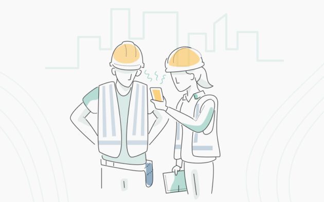 Illustration of two construction workers in hard hats and vests examining a phone, with a city skyline in the background.