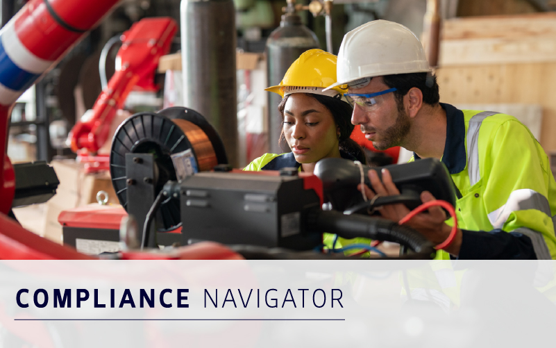 Two engineers in safety gear operate machinery in an industrial setting, with the text "Compliance Navigator" displayed at the bottom.