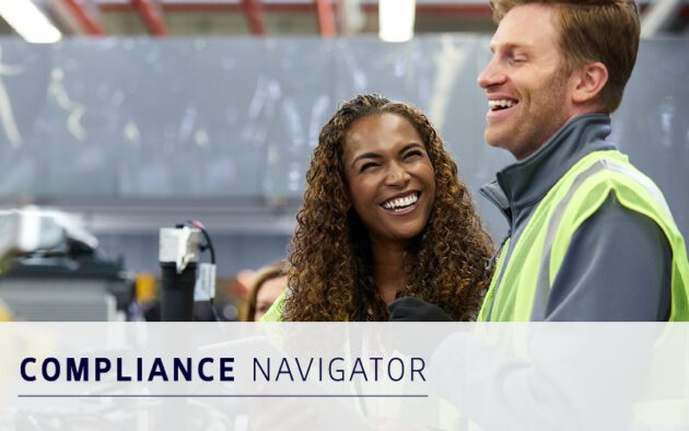 Two people in safety vests smile and talk in an industrial setting. Text on image reads "Compliance Navigator.