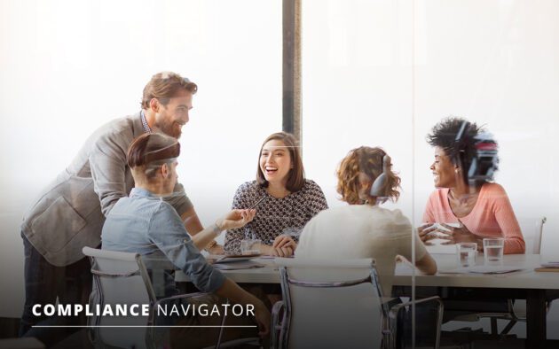 group of employees around a conference table