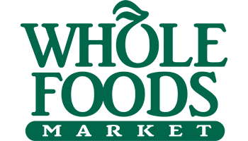 Logo of Whole Foods Market in green text with stylized leaf elements.