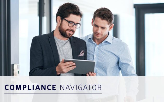 Two men in business attire review compliance information on a digital tablet in a modern office setting, with the text "Compliance Navigator" displayed.