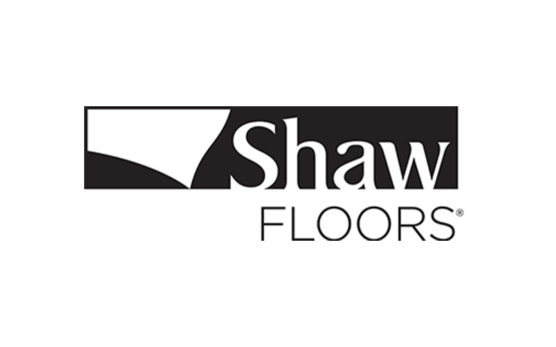 Logo of Shaw Floors featuring a stylized design and company name in bold black text on a white background.