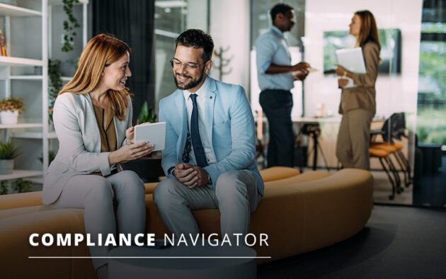 Two people sitting and discussing over a tablet in a modern office, with two others talking in the background. Text reads "Compliance Navigator.