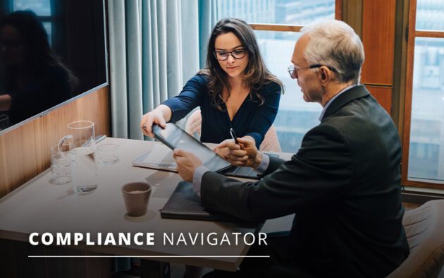 Two people in a meeting room reviewing a document over a table with glasses and cups. Text overlay reads "Compliance Navigator.