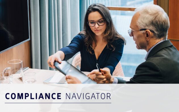 Two professionals sit at a desk reviewing documents together, utilizing workforce compliance software. The words "Compliance Navigator" are displayed at the bottom of the image.