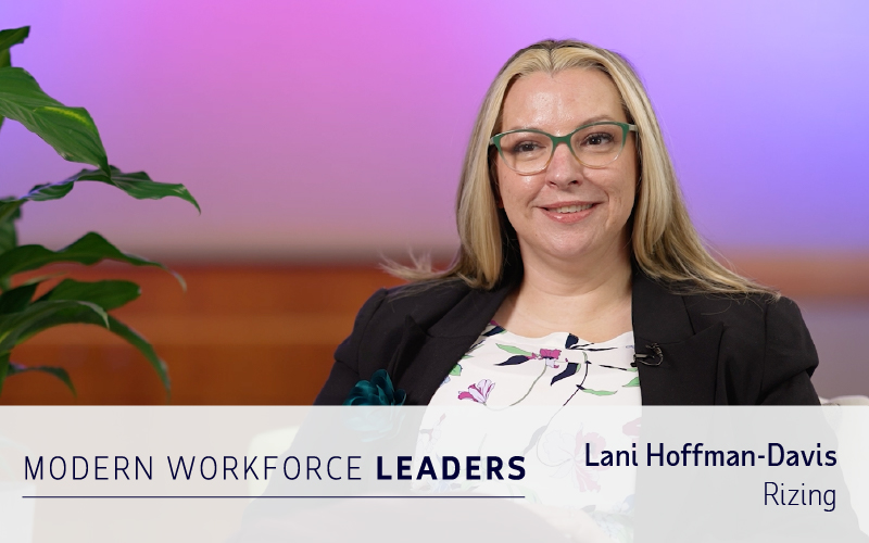 A woman with glasses and long blonde hair sits and smiles. The text reads: “Modern Workforce Leaders. Lani Hoffman-Davis. Rizing.”.