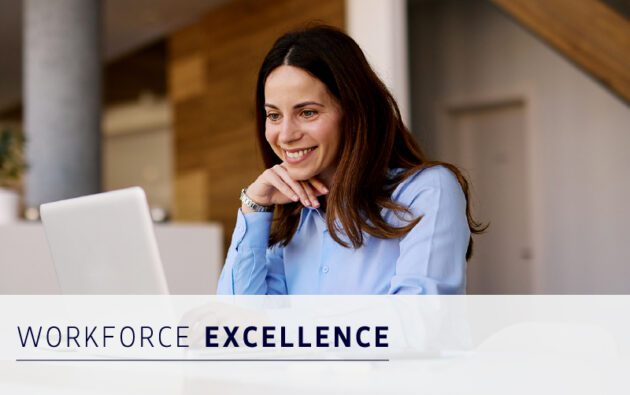 A woman in business attire smiles while working at a laptop, with the text "Workforce Management Excellence" displayed across the image.