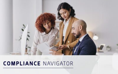 Three professionals review documents together in a modern office setting, with the text "COMPLIANCE NAVIGATOR" displayed in the foreground.