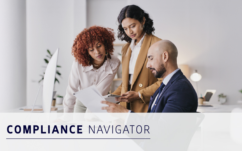 Three professionals review documents together in a modern office setting, with the text "COMPLIANCE NAVIGATOR" displayed in the foreground.