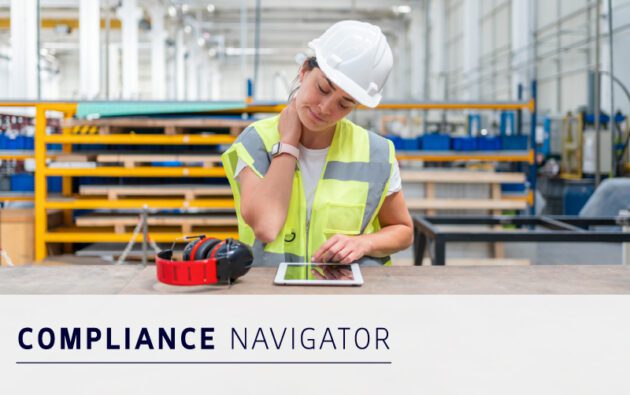 A woman in a safety vest and hard hat stands at a workbench using a tablet, with ear protection nearby. Text reads "COMPLIANCE NAVIGATOR.