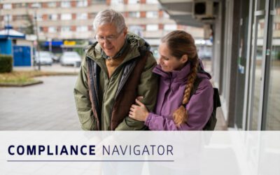 An older man and a younger woman walk arm-in-arm on a city sidewalk. Text overlay reads "COMPLIANCE NAVIGATOR.